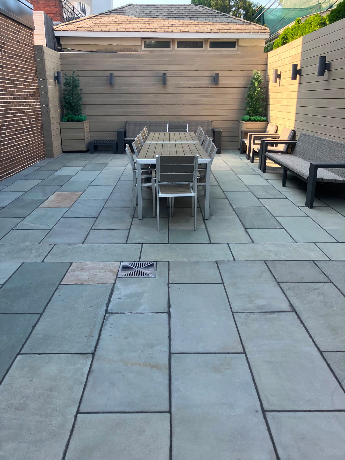 Freshly cleaned bluestone patio behind a Brooklyn home